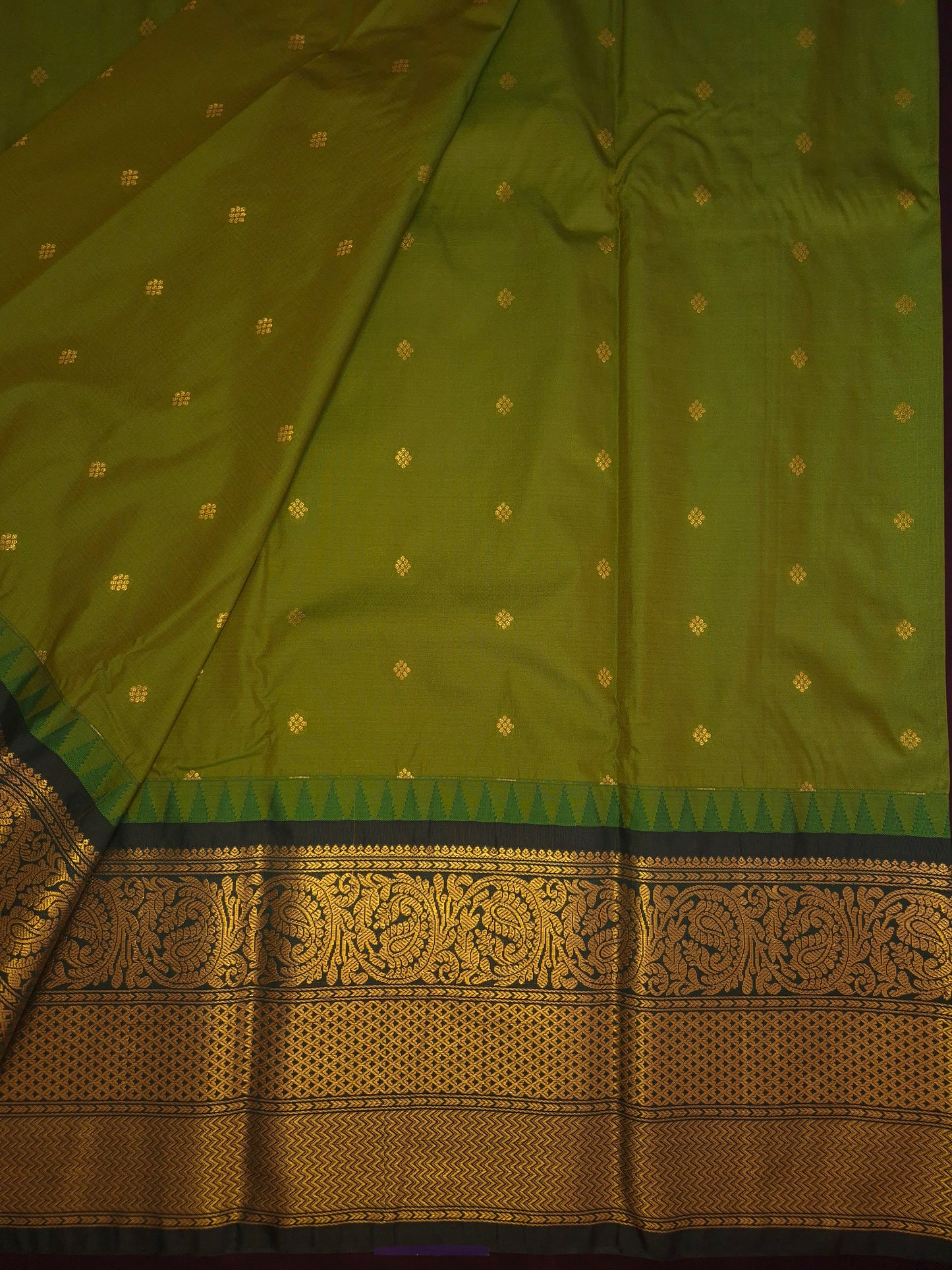Mehendi Green Gadwal Silk Saree with all-over Golden Buttas and Intricate Design on Dark Green Border