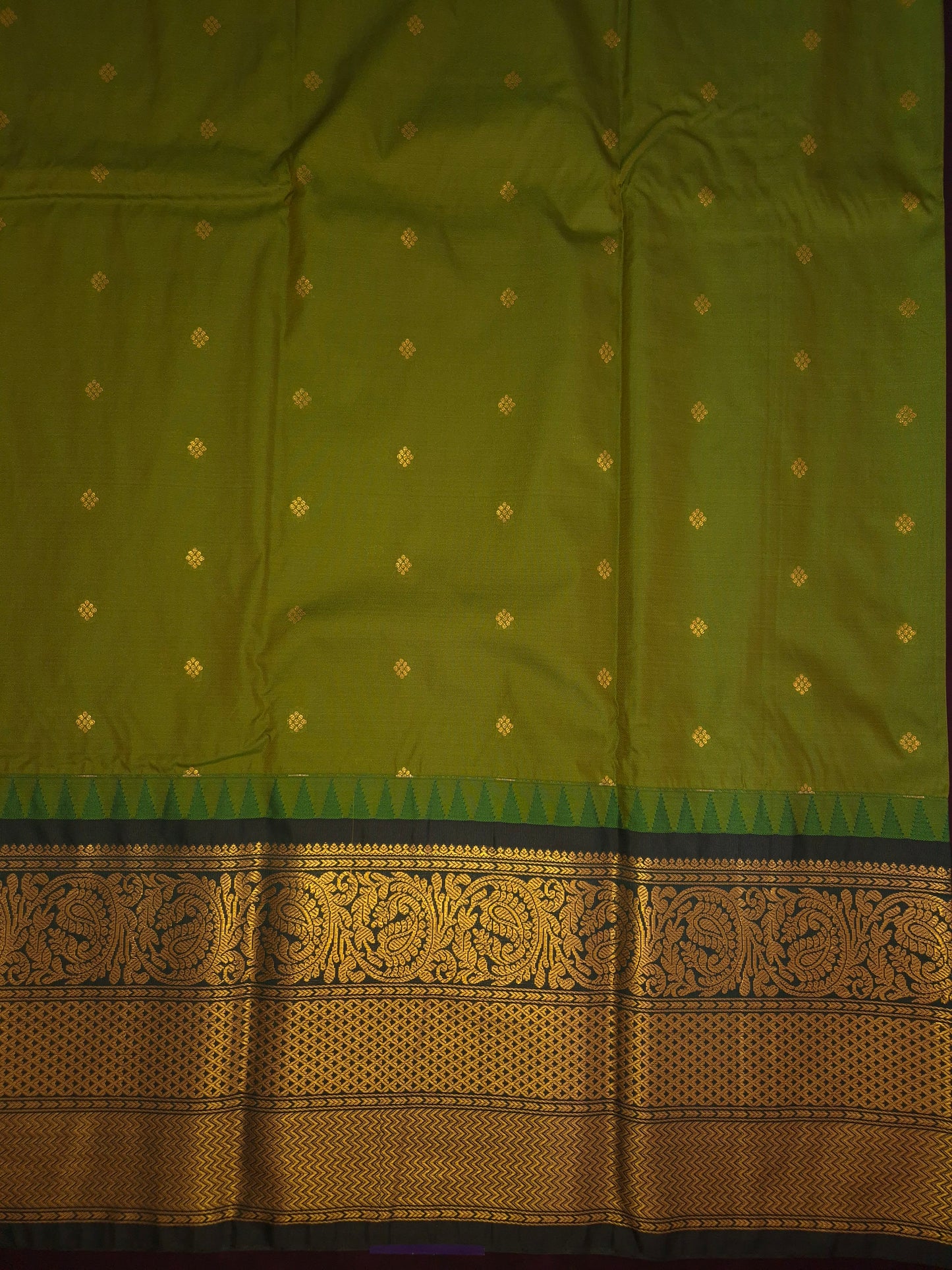 Mehendi Green Gadwal Silk Saree with all-over Golden Buttas and Intricate Design on Dark Green Border