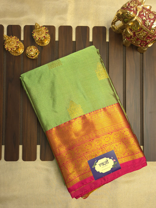Light Green Kanchipuram Silk Saree with Rani Pink Border and Golden Zari