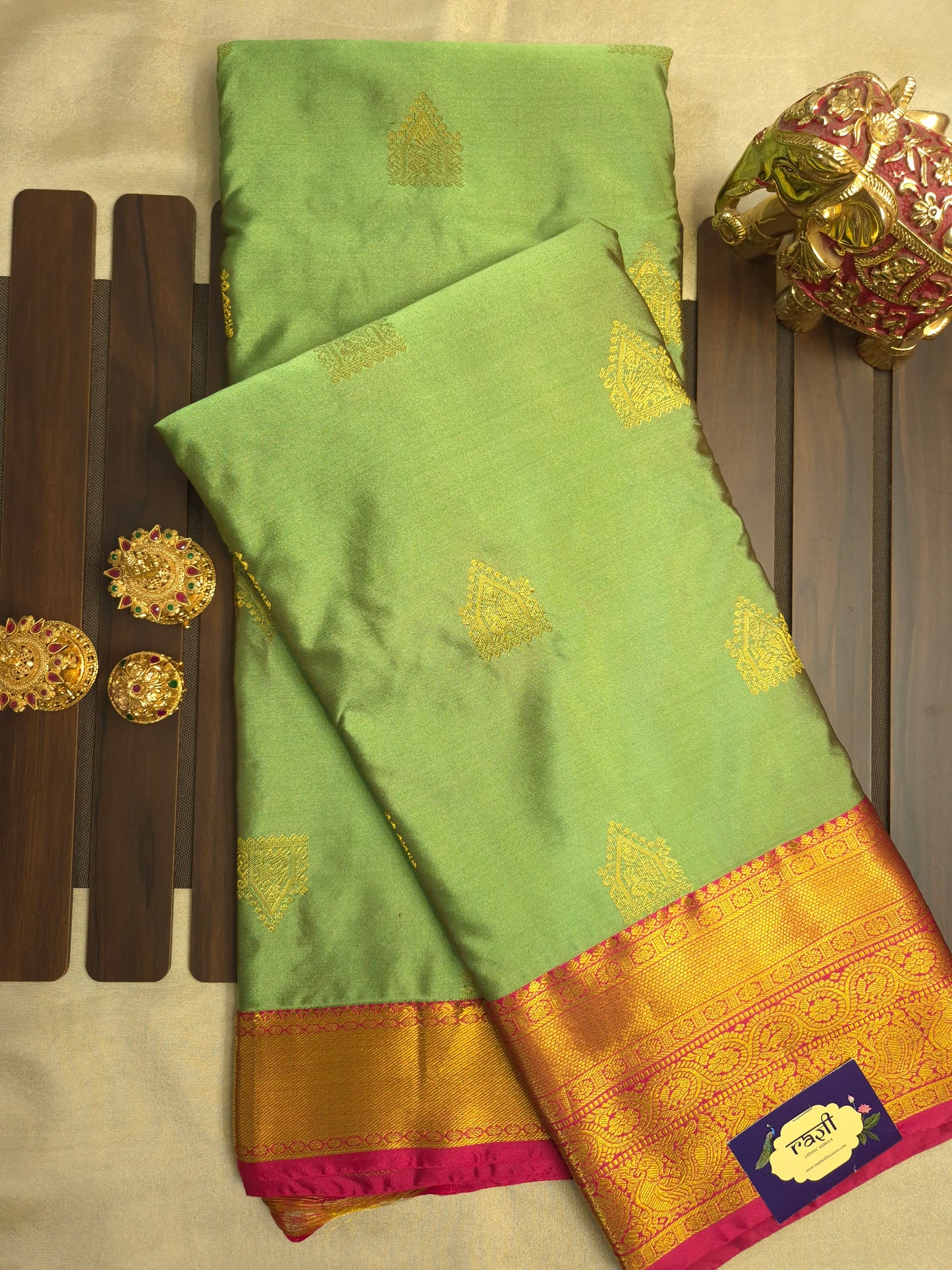 Light Green Kanchipuram Silk Saree with Rani Pink Border and Golden Zari