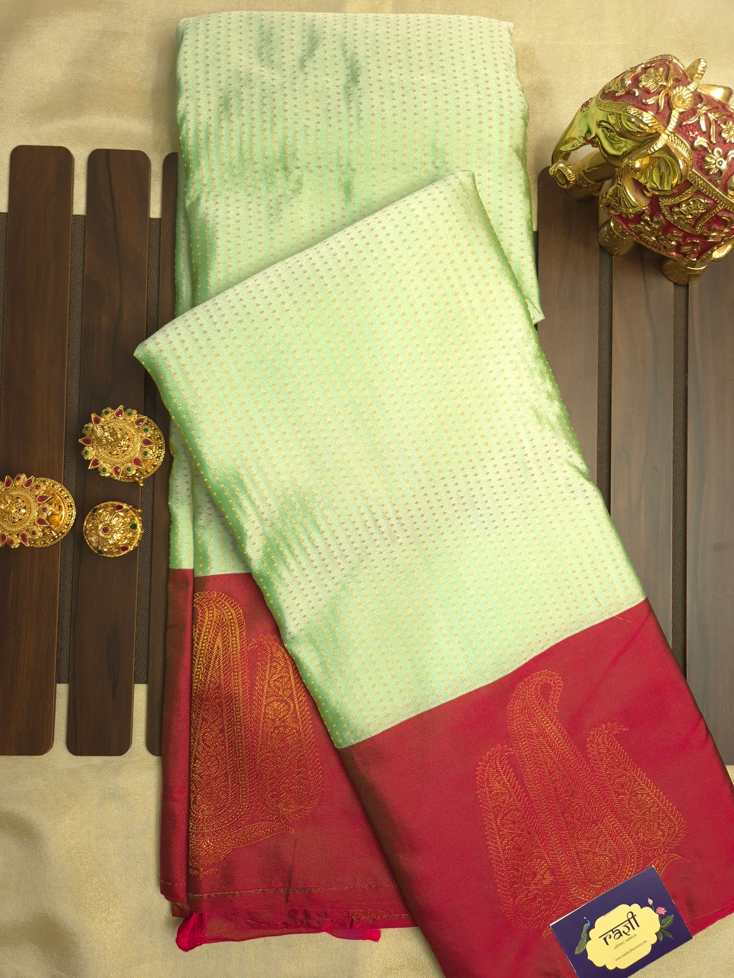 Light Mint Green Kanchipuram Silk Saree with Red Border and Golden Zari